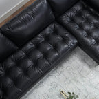 Homecrest Camber sectional sofa in black leather with a deep boxy silhouette and plush button-tufted seating