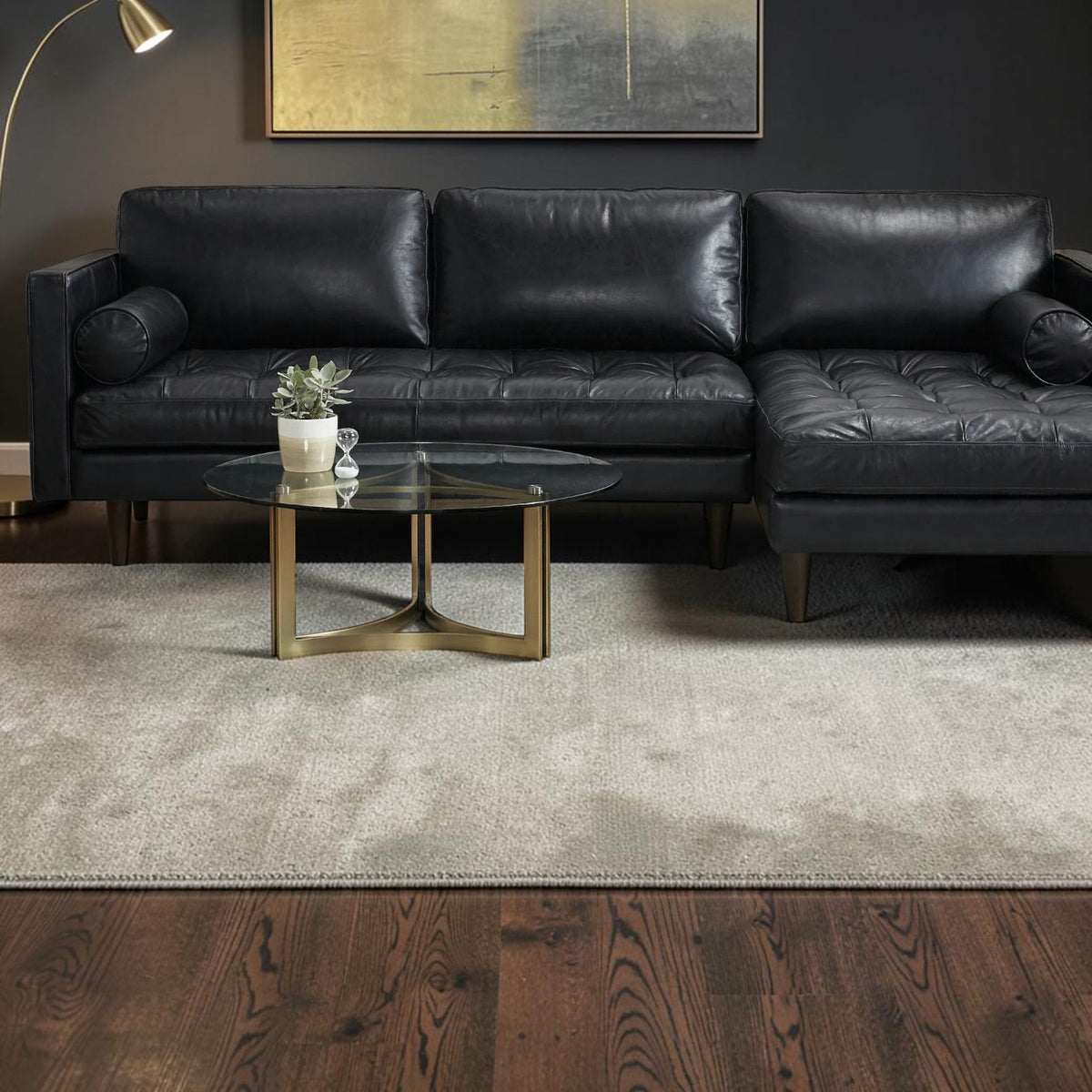Homecrest Camber sectional sofa in rhino black leather with button-tufted seating in a modern living room setting