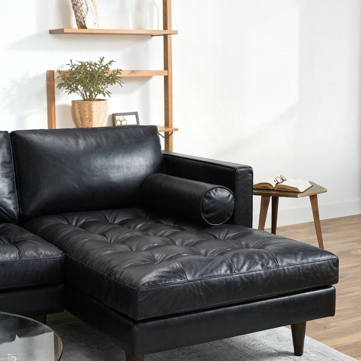Homecrest Camber sectional sofa in black leather with button-tufted seating and a deep boxy silhouette