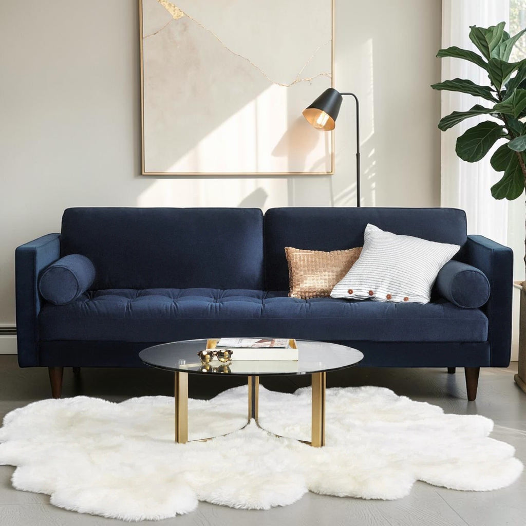 Homecrest Bicknor 2 seater sofa in plush blue suede velvet with tapered legs, styled in a modern living room setting.