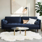 Homecrest Bicknor 2 seater sofa in plush blue suede velvet with tapered legs, styled in a modern living room setting.