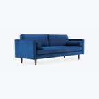Homecrest Bicknor 2 seater sofa in plush blue suede velvet fabric with tapered wooden legs and two bolster cushions.