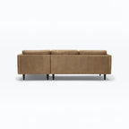 Homecrest Camber sectional sofa in camel brown leather with a boxy silhouette and tapered wooden legs, back view.