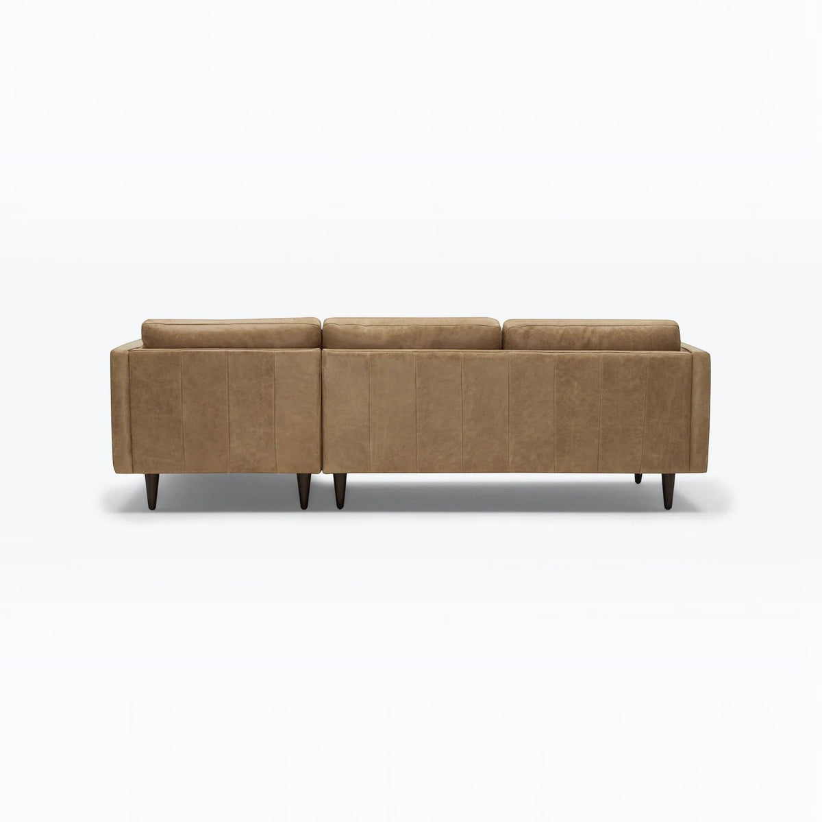 Homecrest Camber sectional sofa in camel brown leather with a boxy silhouette and tapered wooden legs, back view.
