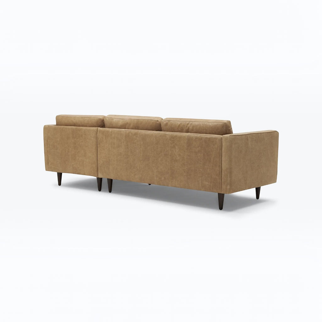 Homecrest Camber sectional sofa in camel brown leather with a boxy silhouette and tapered wooden legs, back view