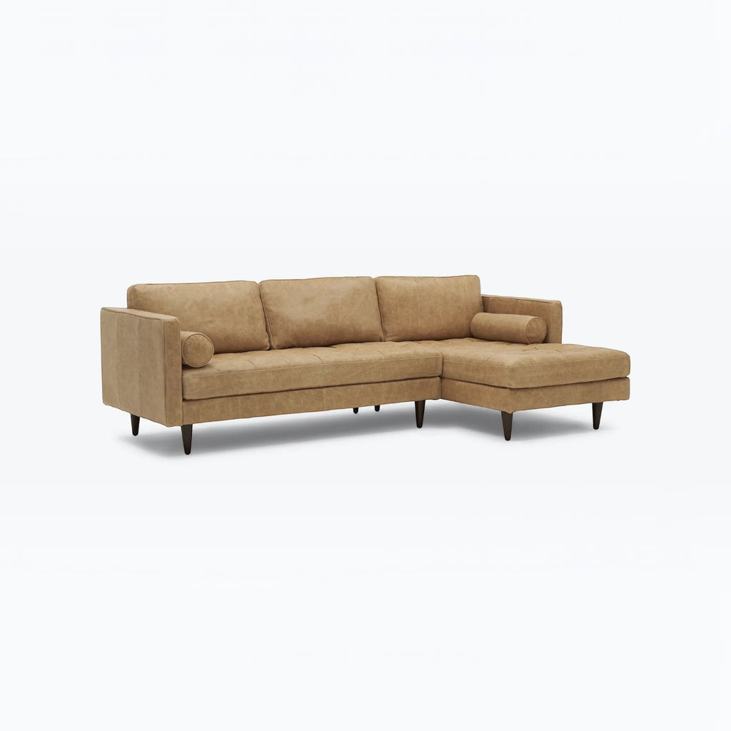 Homecrest Camber camel brown leather sectional sofa with button-tufted seating and a solid wood frame.
