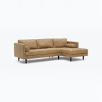 Homecrest Camber camel brown leather sectional sofa with button-tufted seating and a solid wood frame.