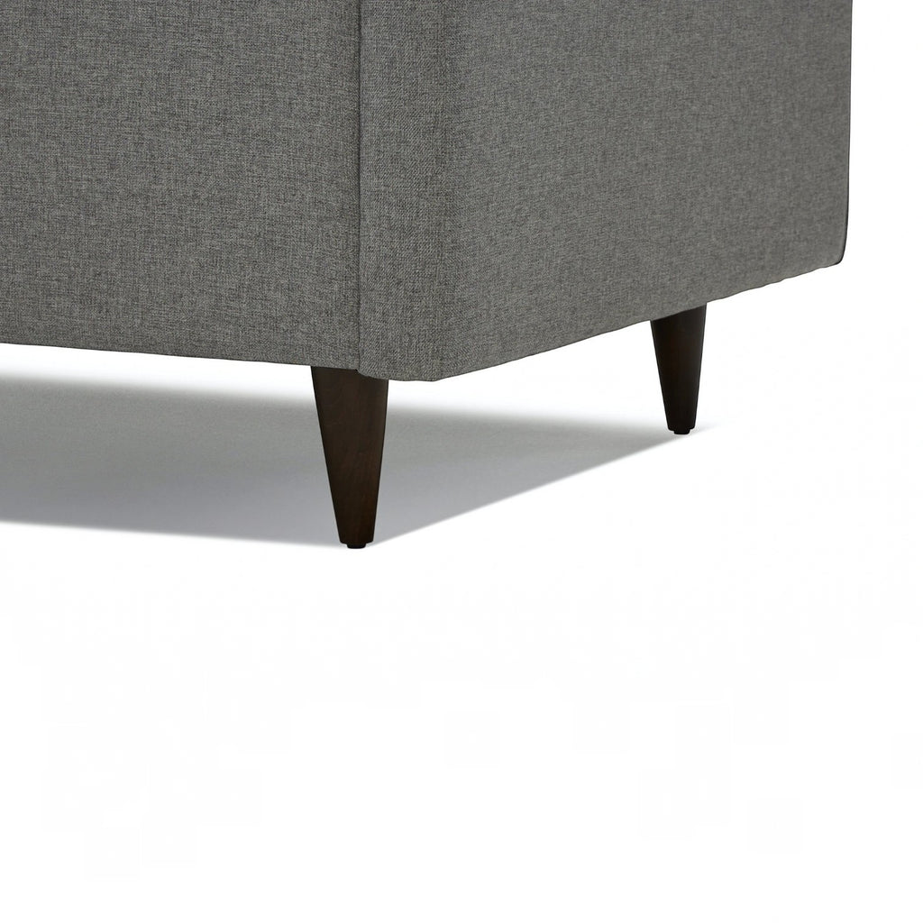 Homecrest Bicknor 2 seater sofa in gray suede velvet fabric featuring dark tapered wooden legs on a white background