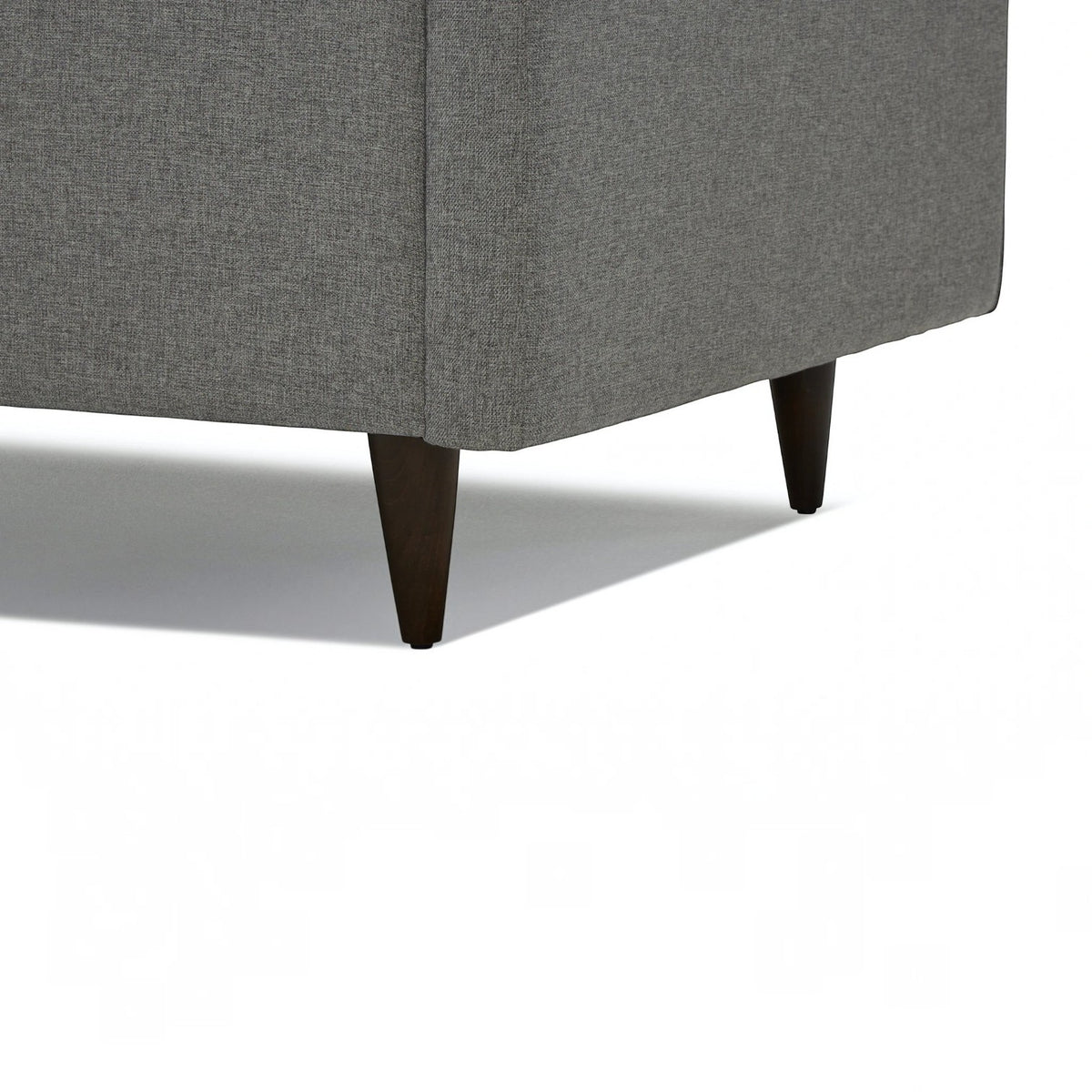Homecrest Bicknor 2 seater sofa in gray suede velvet fabric featuring dark tapered wooden legs on a white background
