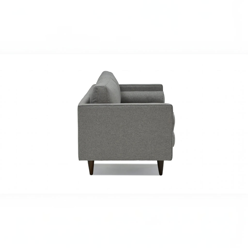 Homecrest Bicknor 2 seater sofa in gray suede velvet fabric with tapered wooden legs, side view.