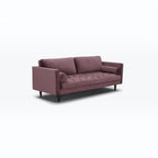 Homecrest Bicknor 2 seater sofa in purple suede velvet fabric with tufted seat and tapered wooden legs.