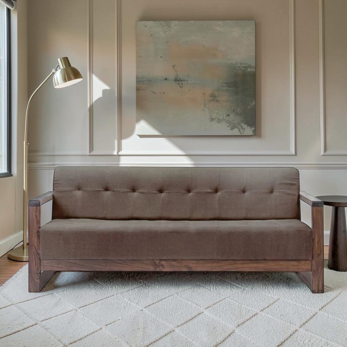 Homecrest 3-seater sofa in brown fabric with a dark walnut solid wood box frame and tufted backrest in a living room.