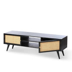 Homecrest Calder black media cabinet with rattan doors, gold handles, and open central shelving on tapered legs.