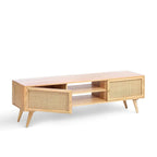 Homecrest Calder media cabinet in natural mango wood with rattan doors, central open shelving, and gold hardware.