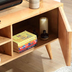 Homecrest Calder media cabinet in natural mango wood with an open side cupboard and rattan door detail