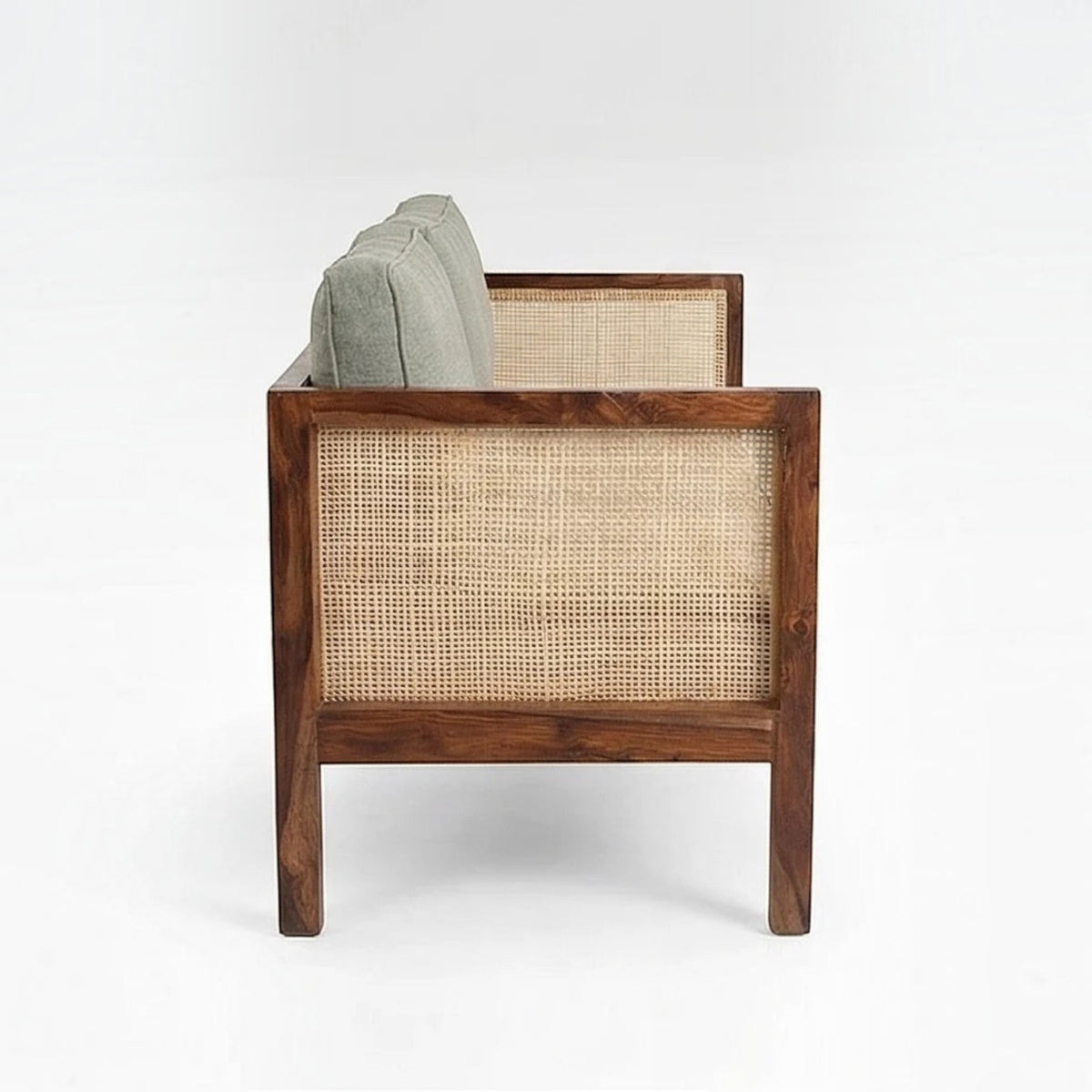Homecrest 2-seater sofa in walnut finish with natural cane side panels and soft green upholstered cushions