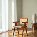 Homecrest Cavendish accent chair in natural teak wood with a woven rattan cane seat and backrest in a sunlit room.