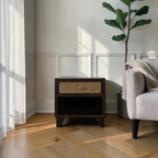 Homecrest Chalford bedside table in dark wood with a cane rattan drawer front and a small brass knob handle