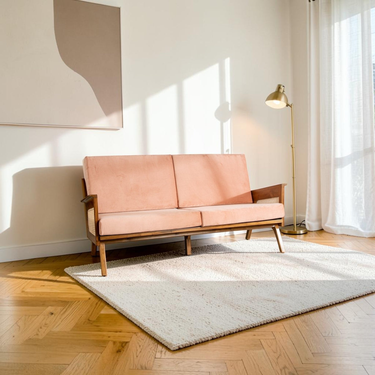 Homecrest Culworth mid-century sofa with a solid teak wood frame and soft peach velvet upholstery in a bright room.