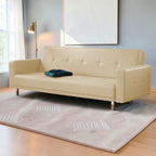 Homecrest Corbett beige leatherette 3-seater sofa bed with tufted detailing on a solid wood frame in a modern room.