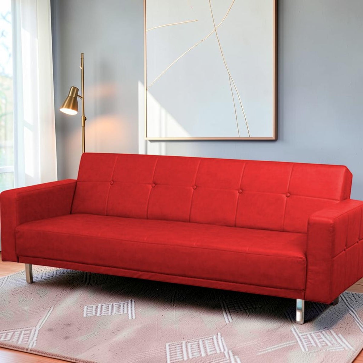 Homecrest Corbett red leatherette three-seater sofa bed with tufted backrest and modern metal legs in a living room.