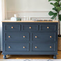 Homecrest Corin wide lowboy chest in blue with natural wood top, framed drawer fronts, and turned wooden knobs.