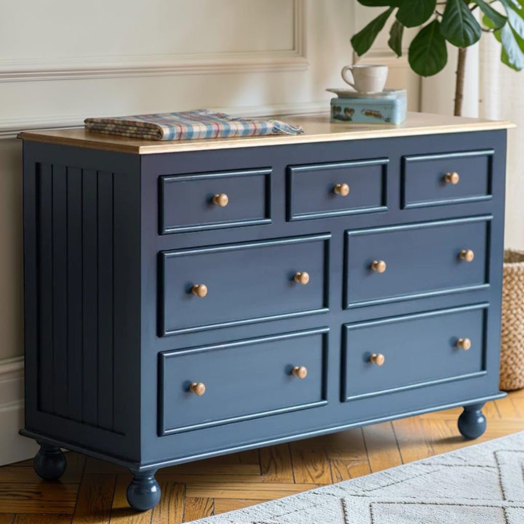 Homecrest Corin wide lowboy chest in dark blue painted finish with solid mango wood top and rustic wooden knobs.