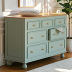 Homecrest Corin wide lowboy chest in sage green with framed drawer fronts, wooden knobs, and curved bun feet.
