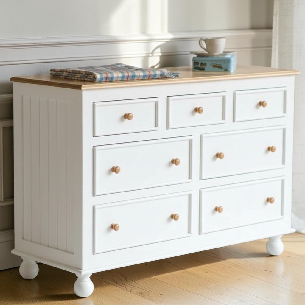 Homecrest Corin wide lowboy chest in white with solid mango wood top, framed drawer fronts, and curved bun feet.