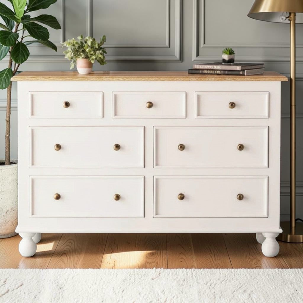 Homecrest Corin wide lowboy chest in white with framed drawer fronts, wooden knobs, and curved bun feet.