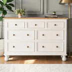 Homecrest Corin wide lowboy chest in white with framed drawer fronts, wooden knobs, and curved bun feet.