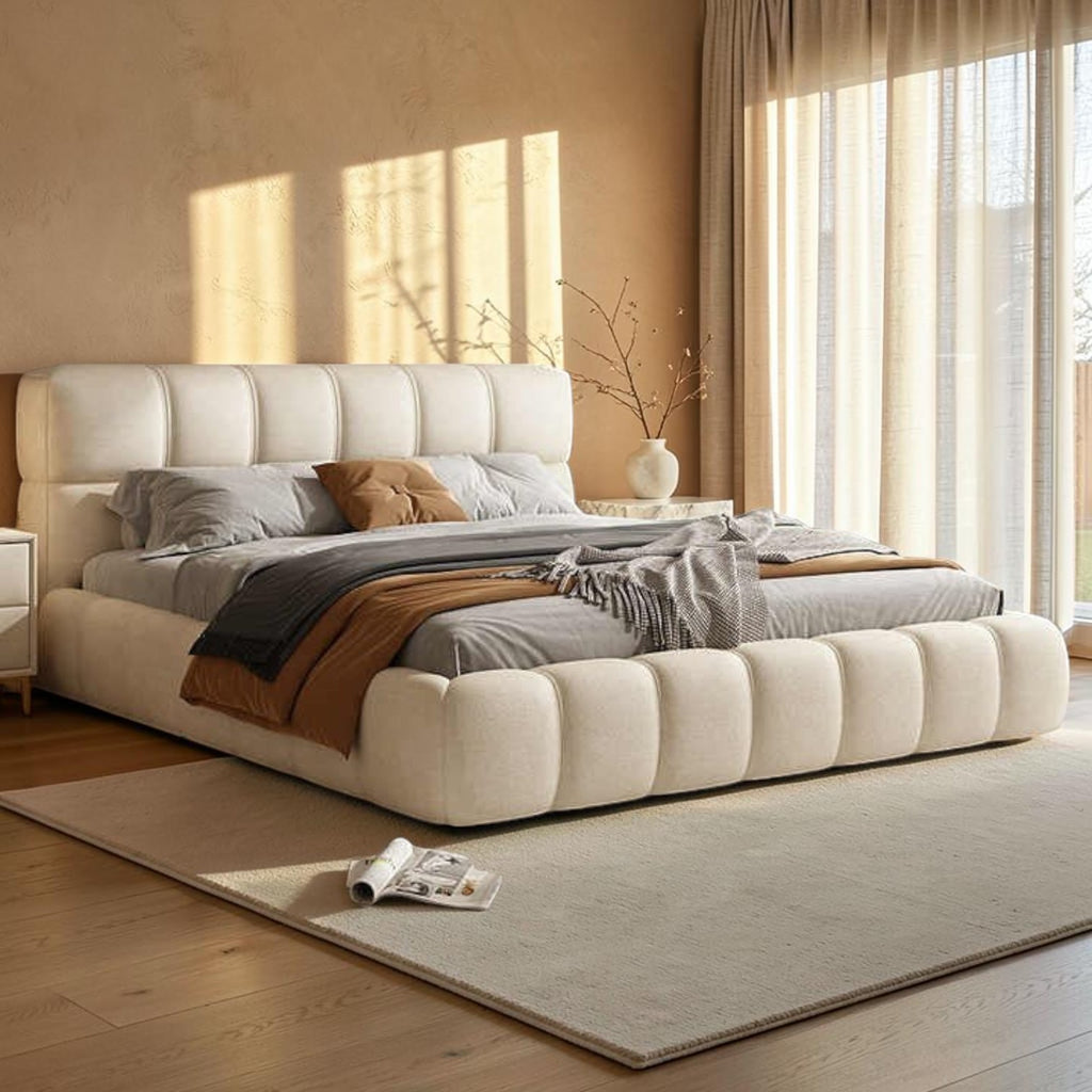 Homecrest cream velvet upholstered platform bed with a tufted headboard and footboard in a modern bedroom setting.