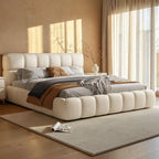 Homecrest cream velvet upholstered platform bed with a tufted headboard and footboard in a modern bedroom setting.