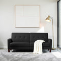 Homecrest Delaney black three-seater sofa bed with tufted backrest and solid wood legs in a modern living room.