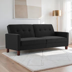 Homecrest Delaney black three-seater sofa bed with tufted back cushions and solid wood legs in a modern living room.