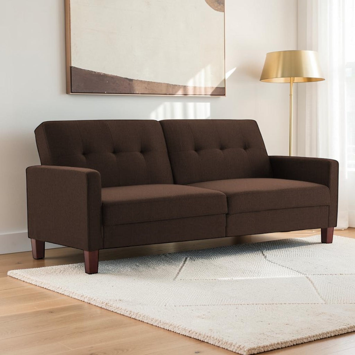 Homecrest Delaney brown three-seater sofa bed with tufted polyester upholstery and solid wood legs in a living room.