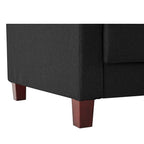 Homecrest Delaney three-seater sofa bed in dark grey polyester fabric with solid wood legs, close-up view.
