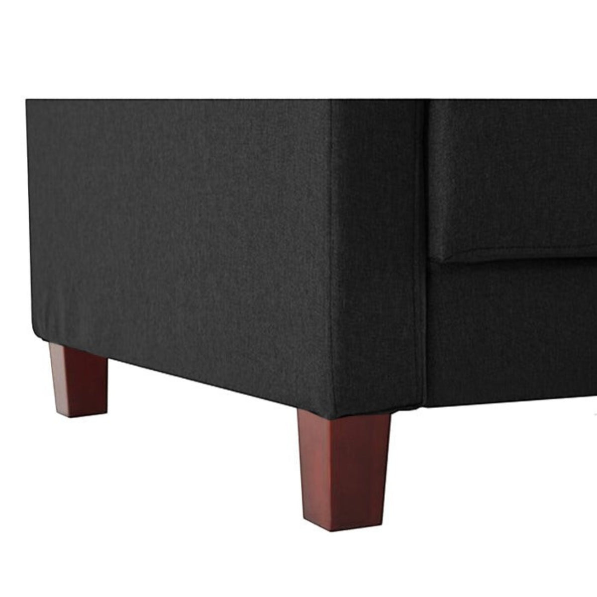 Homecrest Delaney three-seater sofa bed in dark grey polyester fabric with solid wood legs, close-up view.