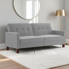 Homecrest Delaney light grey three-seater sofa bed with tufted back cushions and solid wood legs in a modern living room