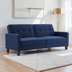 Homecrest Delaney navy blue three-seater sofa bed with tufted back cushions and solid wood legs in a bright room.