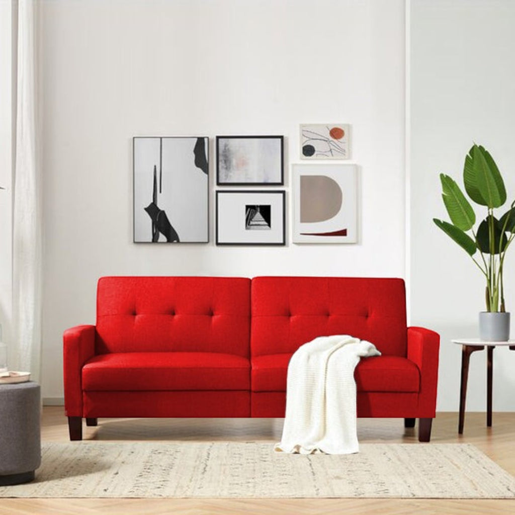 Homecrest Delaney red three-seater sofa bed with tufted polyester upholstery and solid wood frame in a modern living room