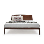 Homecrest Dunsford modern teakwood bed with a sleek chamfered headboard and dark wood frame on a white background