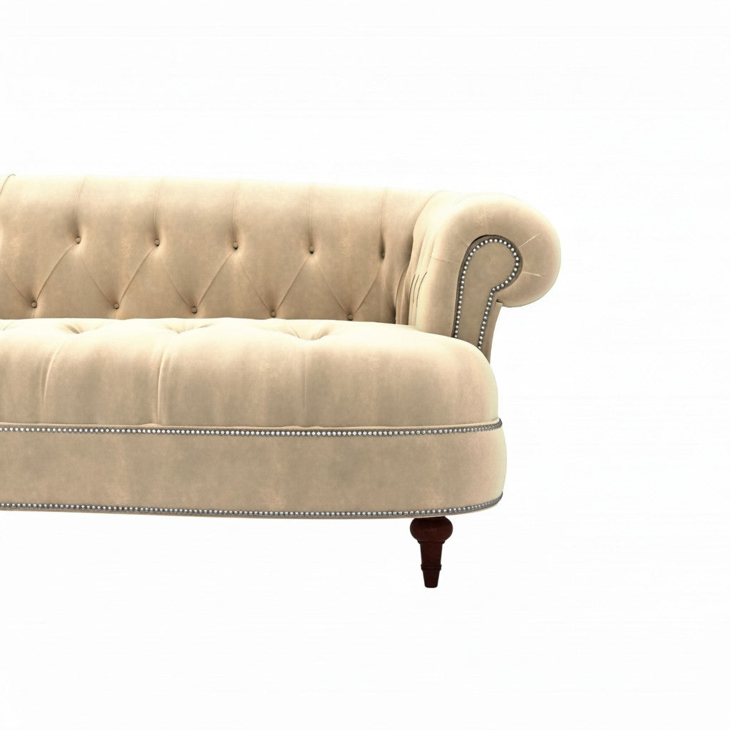 Homecrest Dunmore Chesterfield sofa in beige velvet with tufted backrest, rolled arms, and silver nailhead trim detail.