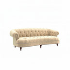 Homecrest Dunmore Chesterfield sofa in beige velvet with tufted backrest and nailhead trim on a white background