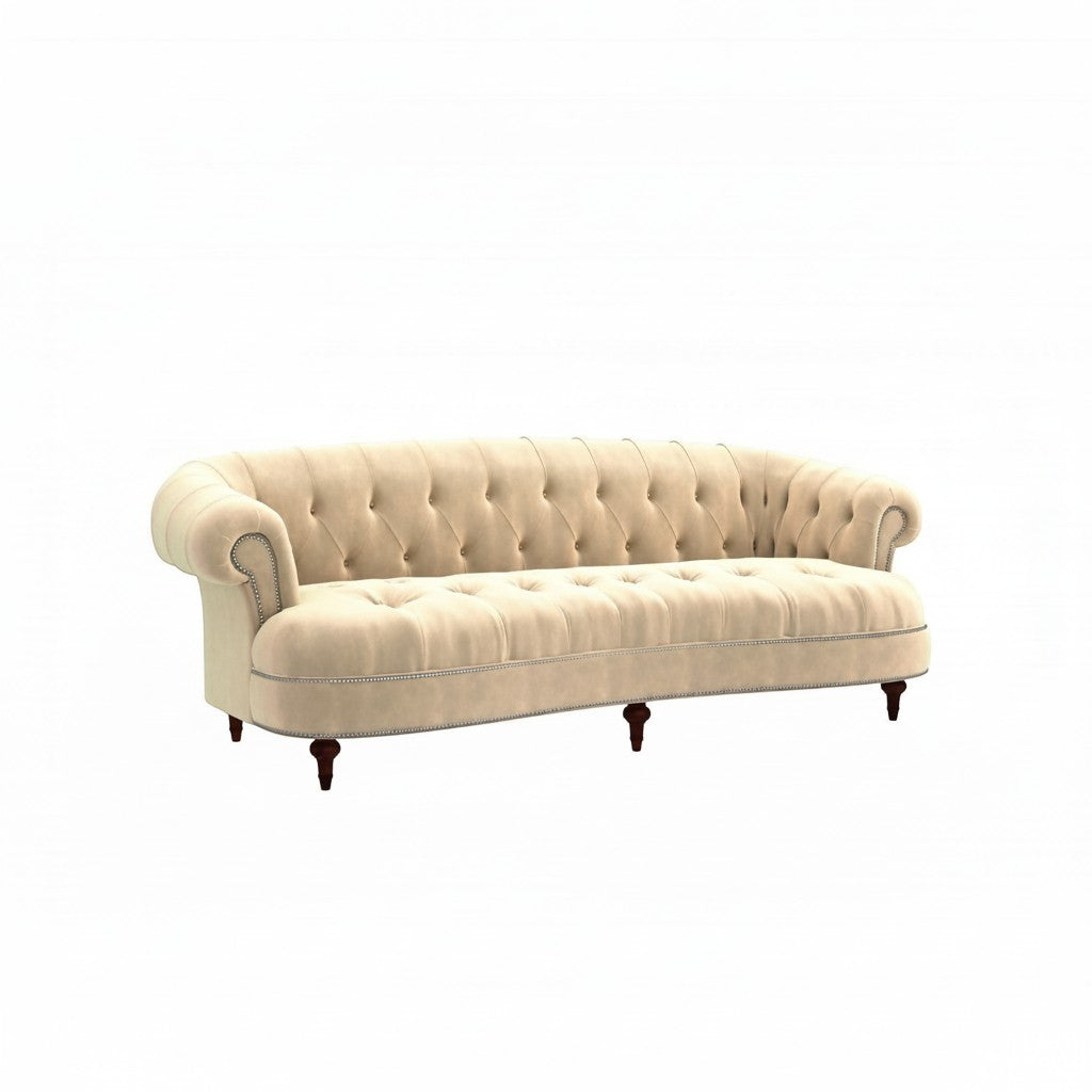 Homecrest Dunmore Chesterfield sofa in beige velvet with tufted backrest and nailhead trim on a white background