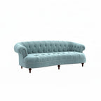Homecrest Dunmore Chesterfield sofa in dusk blue velvet with button tufting, rolled arms, and nailhead trim.