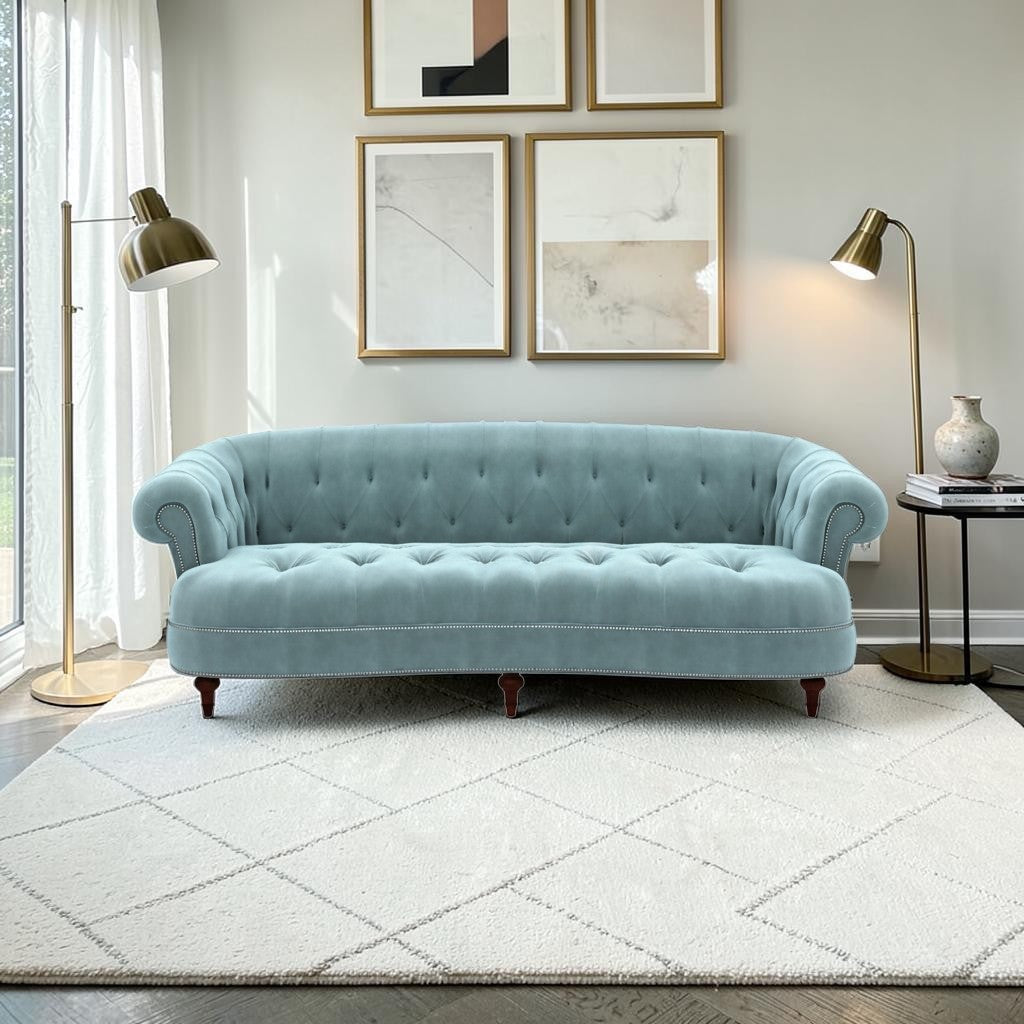 Homecrest Dunmore Chesterfield sofa in dusk blue velvet with button tufting and nailhead trim in a modern living room.