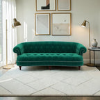 Homecrest Dunmore Chesterfield sofa in emerald green velvet with button tufting and nailhead trim in a modern living room