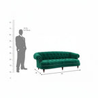 Homecrest Dunmore emerald green velvet Chesterfield sofa with tufted back and nailhead trim, shown with scale reference.