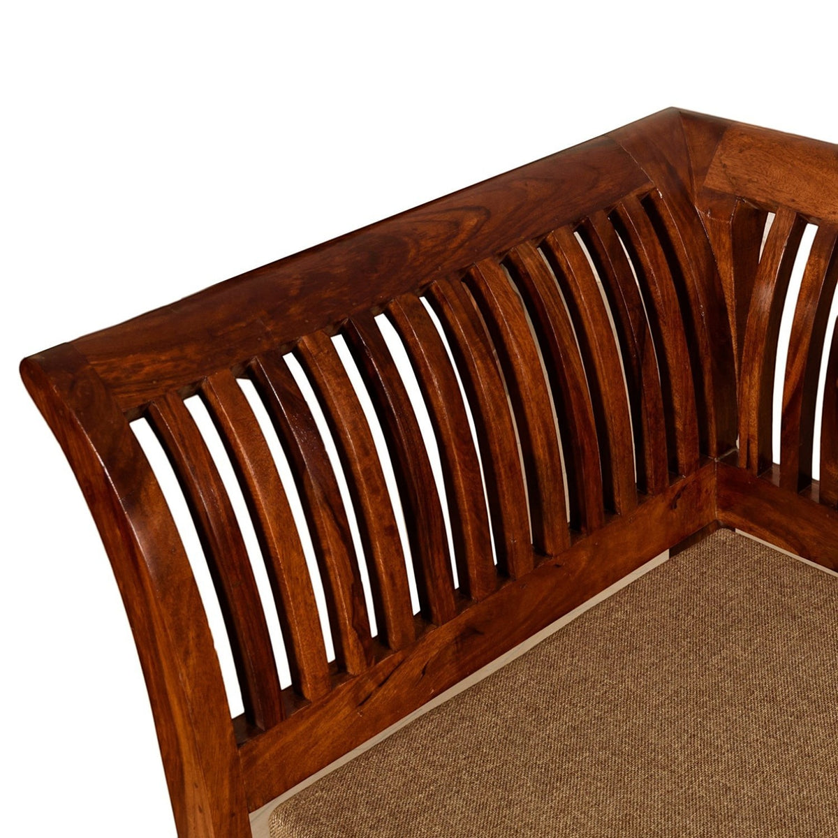 Homecrest Fairlight sofa corner detail featuring rich brown sheesham wood with elegant slatted back and beige cushion